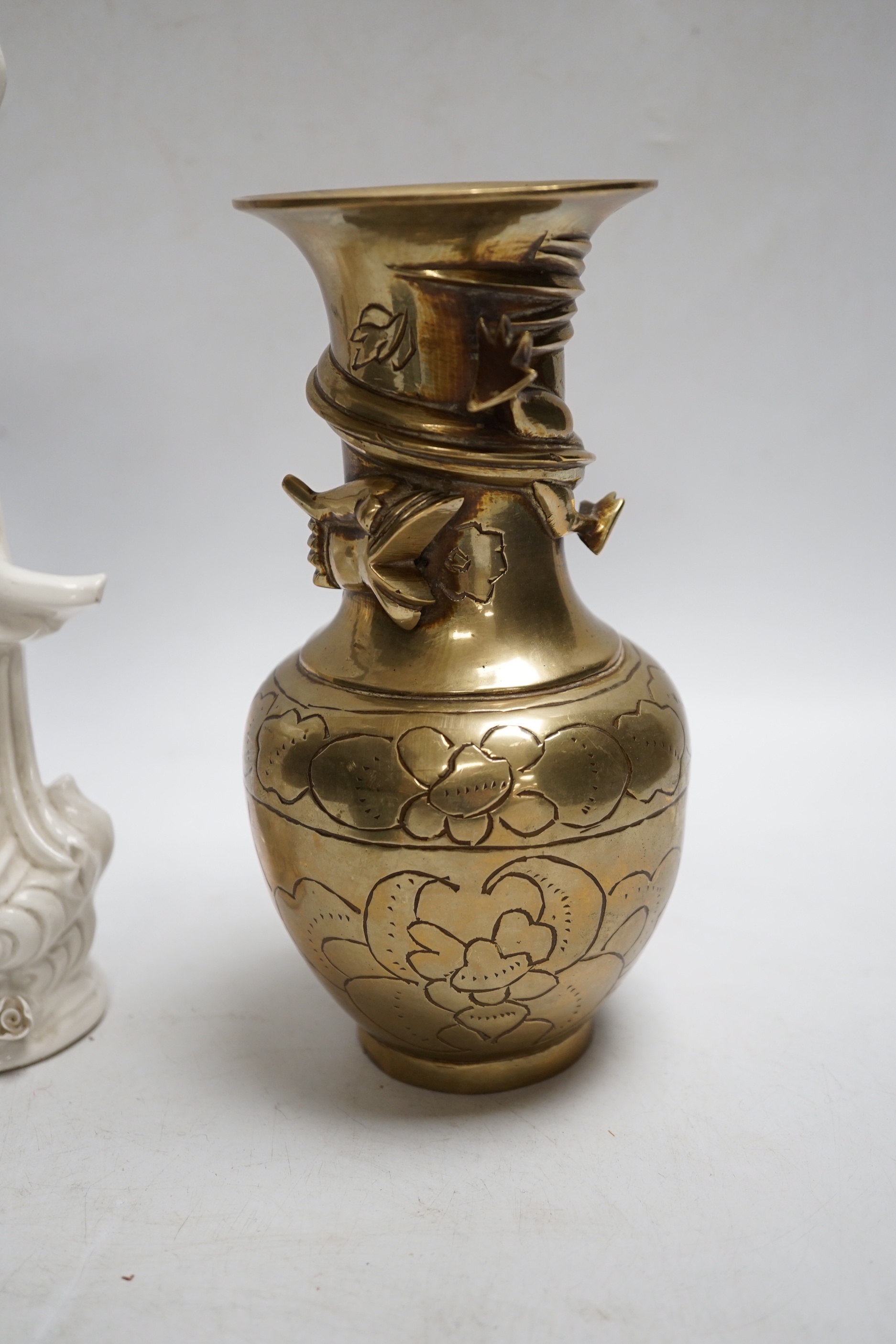 A Chinese blanc de chine model of Guanyin, a bronze vase, a hardstone concentric ball, a blue jar and dish (5), tallest 25cm